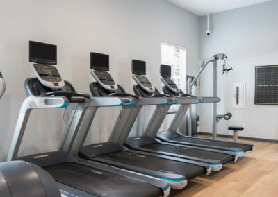 fitness room with treadmills at cadence at southern university apartments