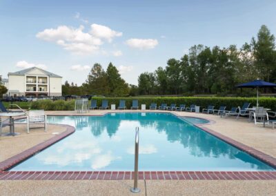 outdoor pool area at cadence at southern university apartments