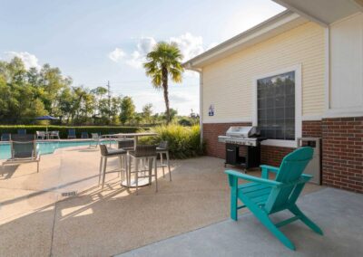 patio by the pool at cadence at southern university apartments